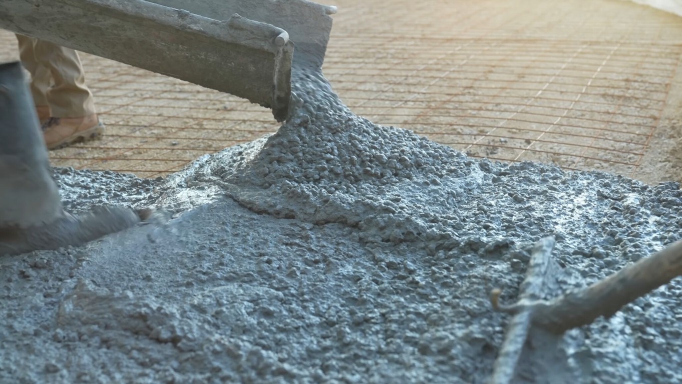 Close-up of concrete being poured showing professional mixing and texture