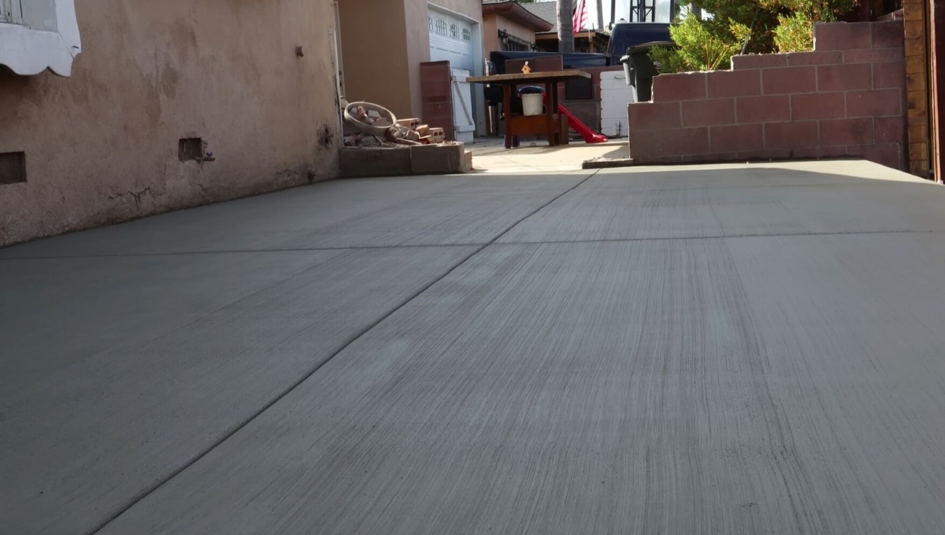 Smooth concrete sidewalk with broom finish texture