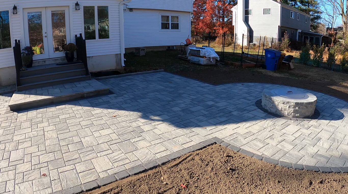Custom stamped concrete patio with outdoor firepit
